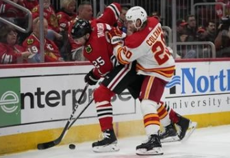 Blackwell helps the Blackhawks beat the Flames 4-3 in first game without Bedard