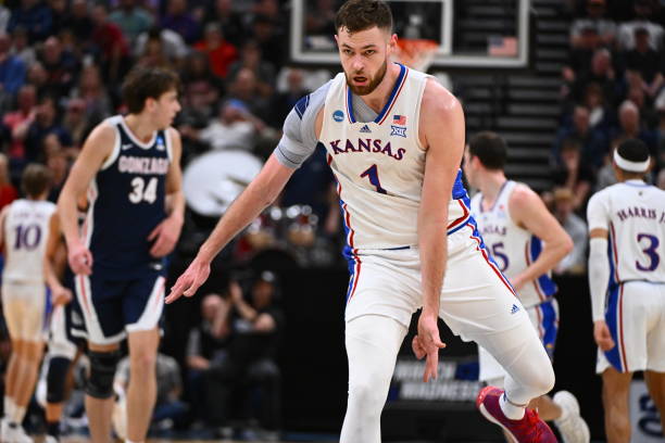 Hunter Dickinson is working to persuade Jeremy Roach from Duke to join Kansas.