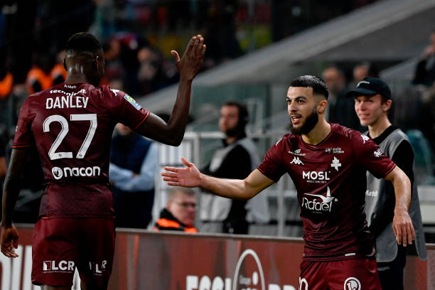Metz's Georgian forward #10 Georges Mikautadze (R) celebrates scoring with Metz's Haitian midfielder #27 Danley Jean Jacques (L)