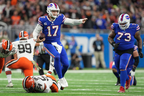Josh Allen #17 of the Buffalo Bills runs past Deion Jones #54 of the Cleveland Browns