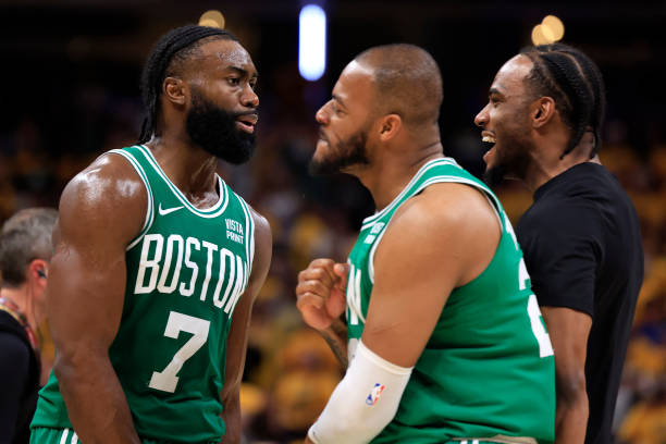 (L-R) Jaylen Brown #7, Xavier Tillman #26 and Oshae Brissett #12 of the Boston Celtics