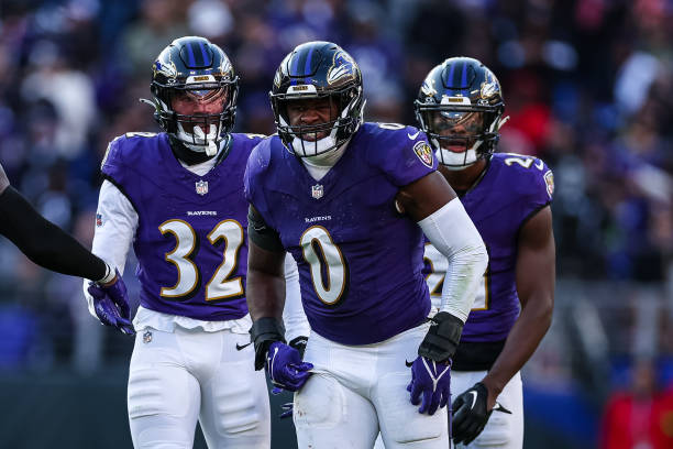 Roquan Smith #0 of the Baltimore Ravens celebrates with Patrick Queen #6, Marcus Williams #32, and Brandon Stephens #21 after a play against the Cleveland Browns during the second half at M&T Bank Stadium