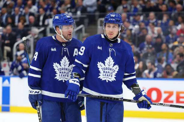 Toronto Maple Leafs defenseman Morgan Rielly (44) talks with Toronto Maple Leafs left wing Tyler Bertuzzi (59)