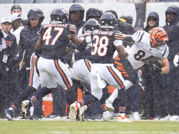 Chicago Bears tight end Marcedes Lewis (84) runs the ball against Chicago Bears linebacker Micah Baskerville (47) and Chicago Bears safety Douglas Coleman III (38)