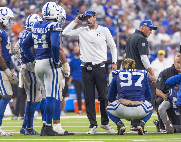 Head coach Shane Steichen checks on Kenny Moore II #23 of the Indianapolis Colts
