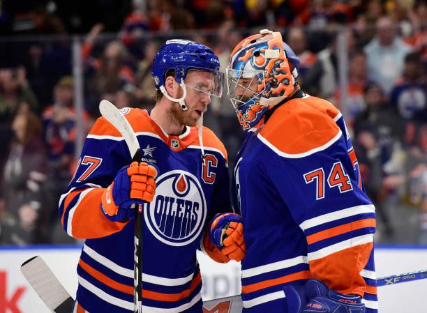 Connor McDavid #97 and Stuart Skinner #74 of the Edmonton
