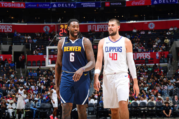 DeAndre Jordan #6 of the Denver Nuggets and Ivica Zubac #40 of the LA Clippers