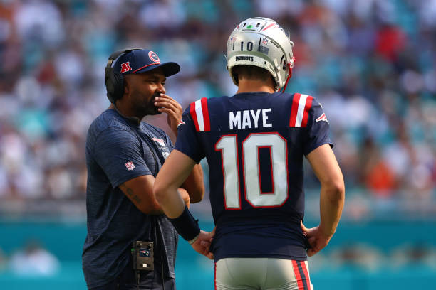Head coach Jerod Mayo and Drake Maye #10 of the New England Patriots